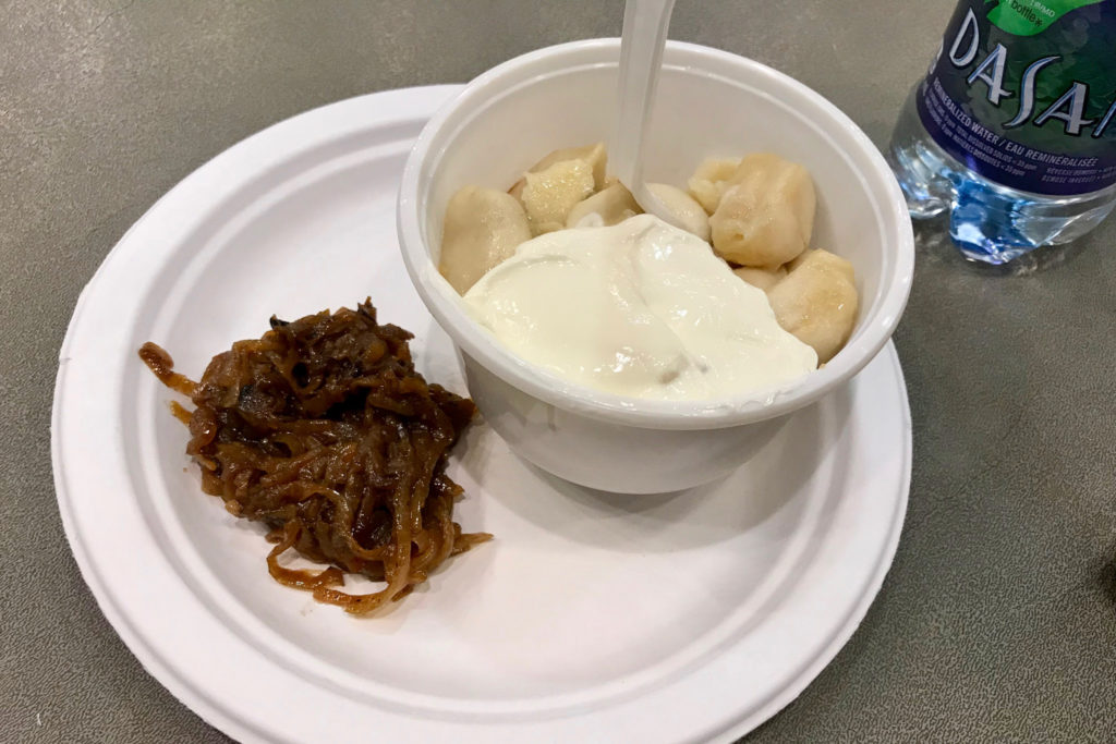 Pierogis with onions and sour cream